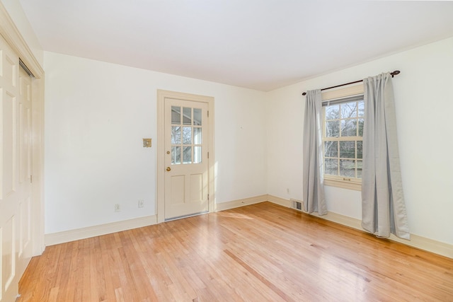 2136 Adena Ln, Lexington, KY 40516 - spare room with light wood-style floors, visible vents, and baseboards