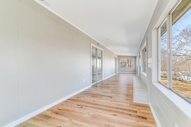 unfurnished sunroom featuring visible vents