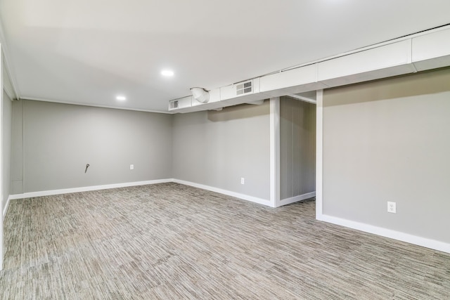 finished below grade area with visible vents, recessed lighting, carpet, and baseboards