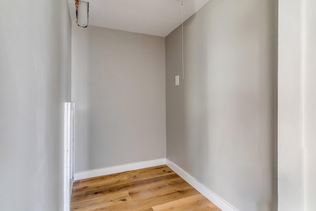 interior space with baseboards and light wood-style flooring