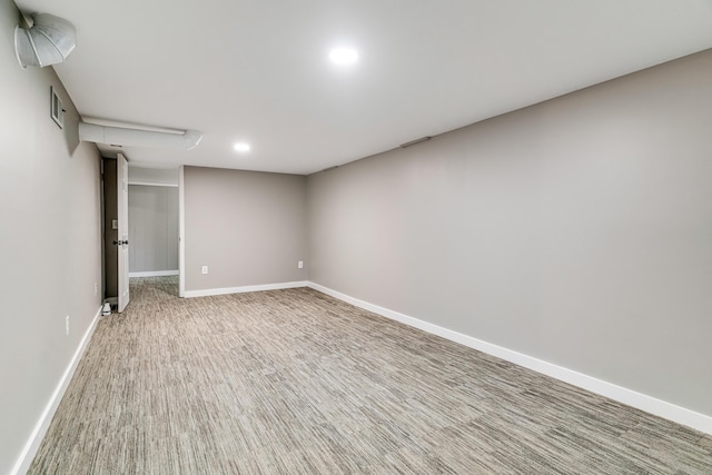 finished below grade area featuring carpet flooring, recessed lighting, and baseboards