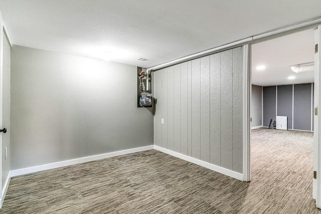 spare room featuring baseboards