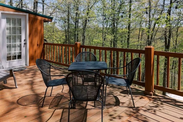 deck featuring outdoor dining area