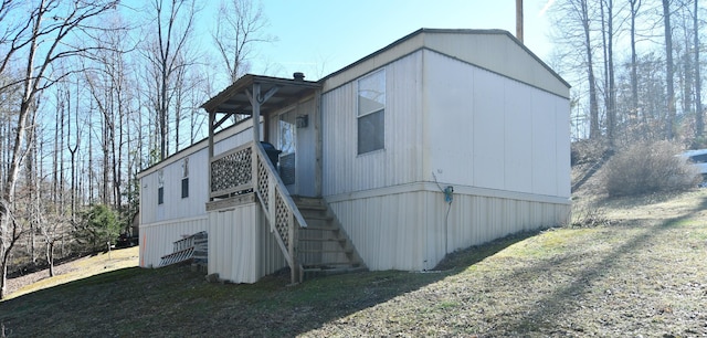 view of outbuilding featuring stairs