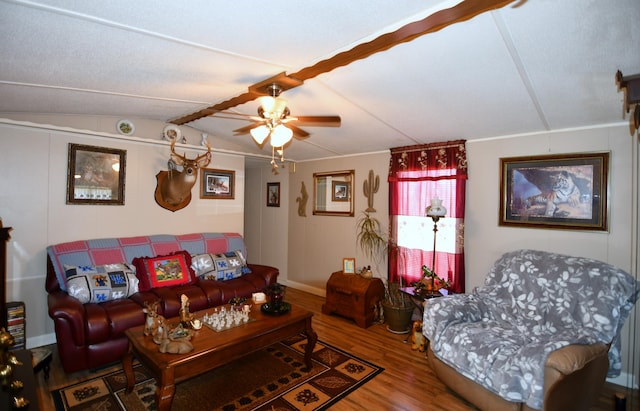 living area with vaulted ceiling, ceiling fan, and wood finished floors