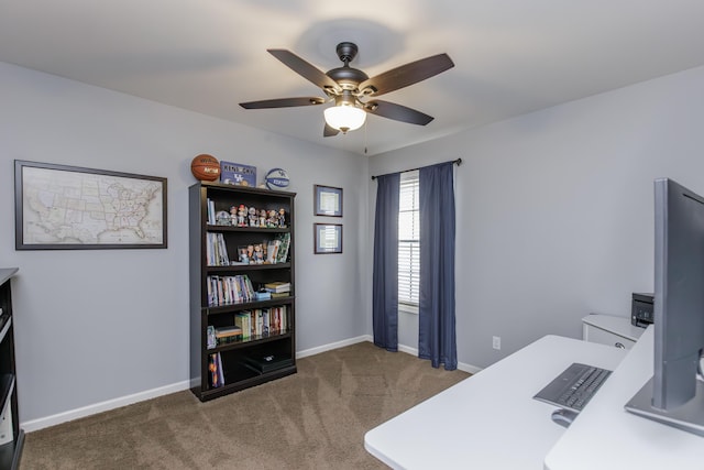 office space with a ceiling fan, carpet, and baseboards