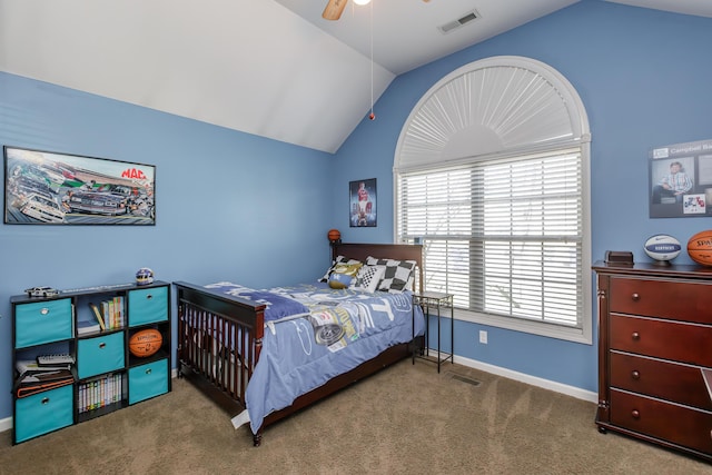 carpeted bedroom featuring visible vents, lofted ceiling, baseboards, and a ceiling fan