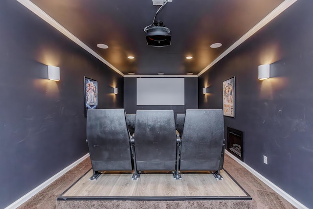 cinema with crown molding, carpet flooring, and baseboards