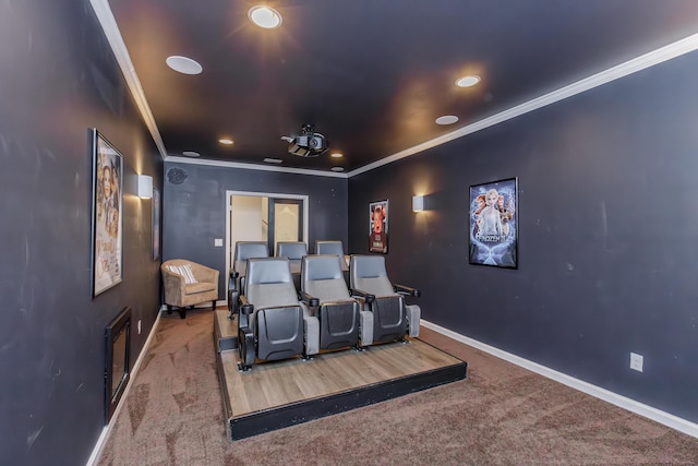 carpeted home theater room featuring recessed lighting, crown molding, and baseboards