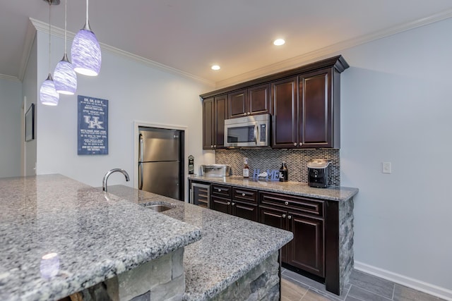 kitchen featuring decorative backsplash, dark brown cabinets, appliances with stainless steel finishes, and crown molding