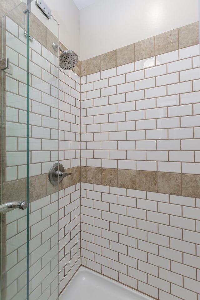 bathroom with a shower stall