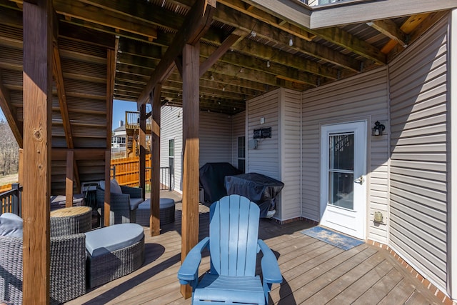 wooden terrace with a grill