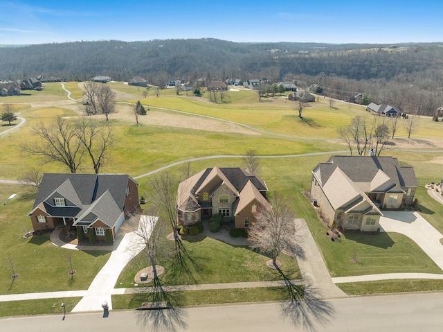 birds eye view of property featuring a view of trees