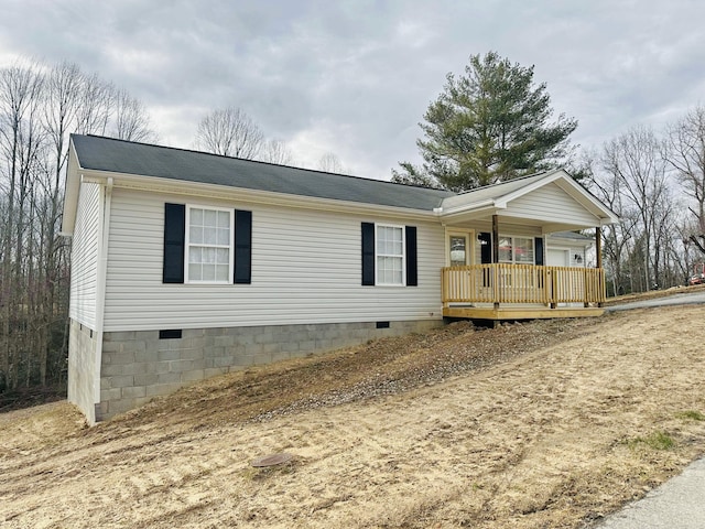 single story home featuring crawl space and a porch