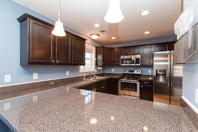 kitchen with visible vents, a sink, recessed lighting, stainless steel appliances, and dark brown cabinetry