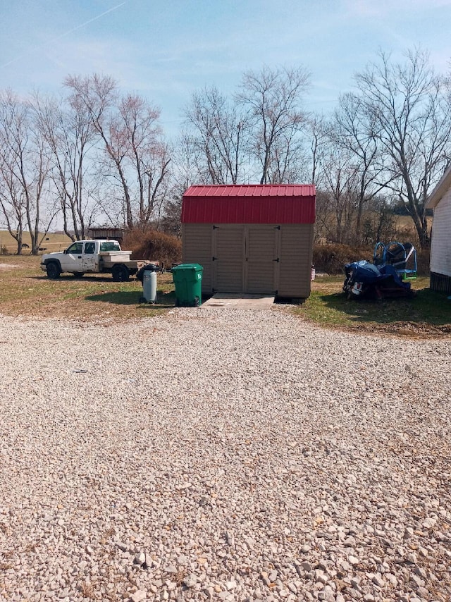 exterior space with an outdoor structure and a shed