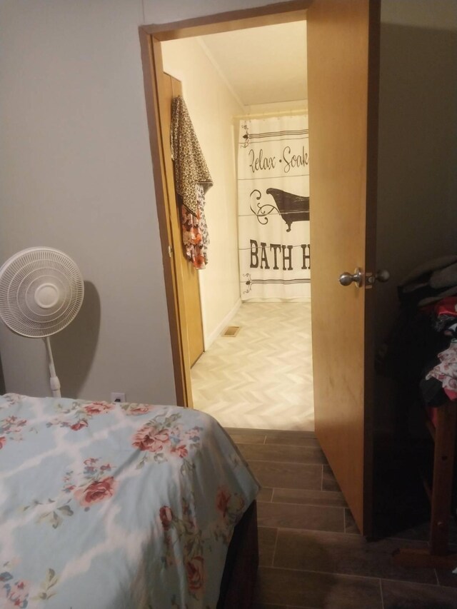 250 Ore Mines Rd, Owingsville, KY 40360 - bedroom featuring wood tiled floor and crown molding