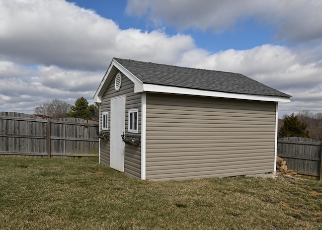 view of shed with a fenced backyard