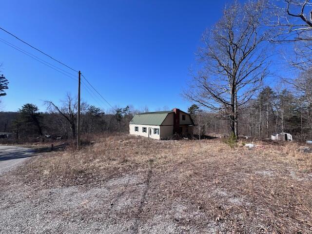 view of yard with a barn and an outdoor structure