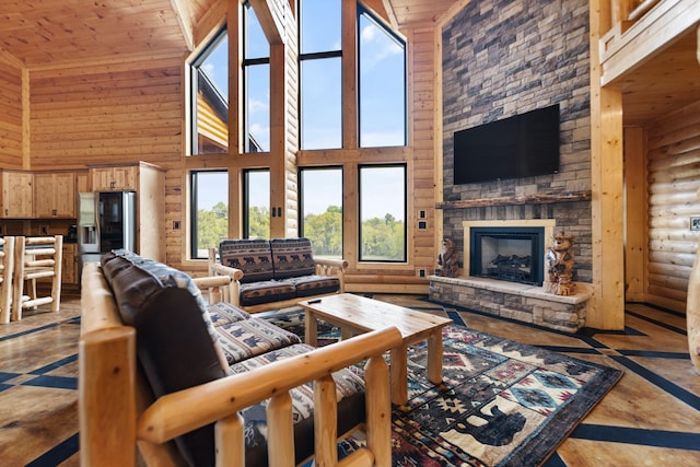 living room with a stone fireplace, wooden ceiling, and high vaulted ceiling