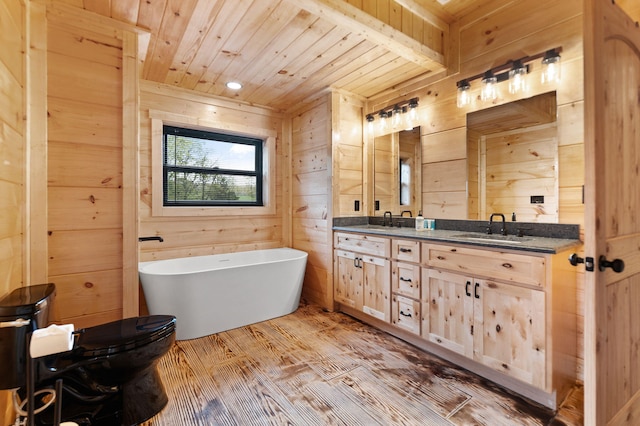 full bath featuring a sink, wooden walls, and wood ceiling