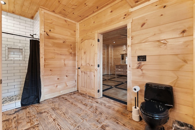 interior space featuring wood walls, wood ceiling, a shower with curtain, and wood finished floors