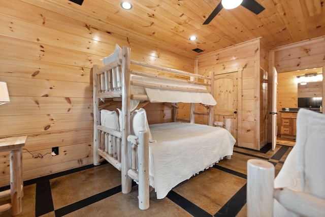 bedroom with wooden walls, recessed lighting, and wooden ceiling