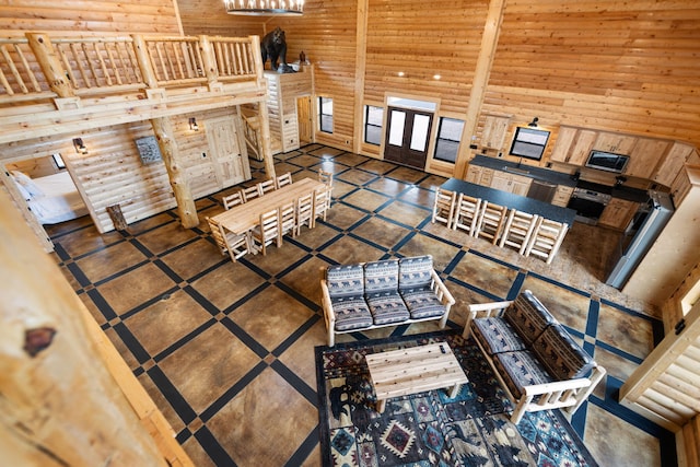living room featuring french doors and a towering ceiling