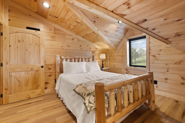 bedroom featuring vaulted ceiling, wooden walls, wooden ceiling, and hardwood / wood-style floors