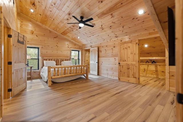 bedroom with wood walls, wooden ceiling, light wood-style floors, and vaulted ceiling