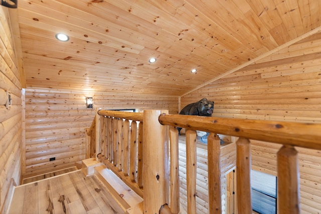 hallway with a sauna, wood ceiling, lofted ceiling, hardwood / wood-style floors, and an upstairs landing