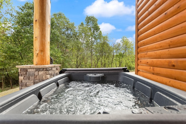 view of patio / terrace with a hot tub