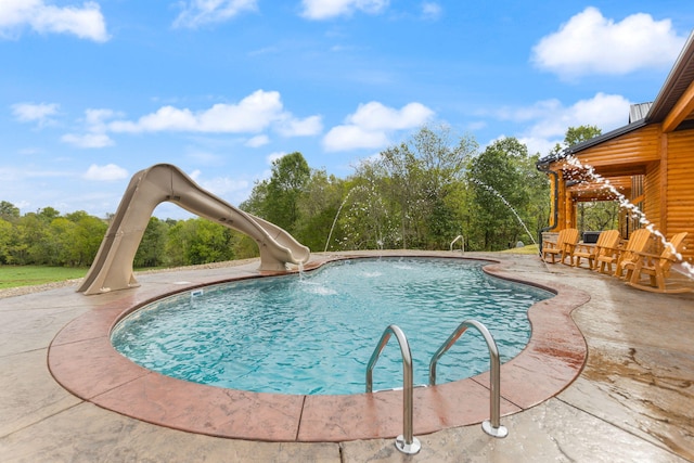 pool with a patio area and a water slide