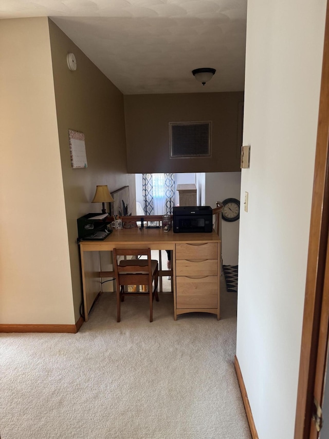 office area featuring visible vents, baseboards, and carpet floors