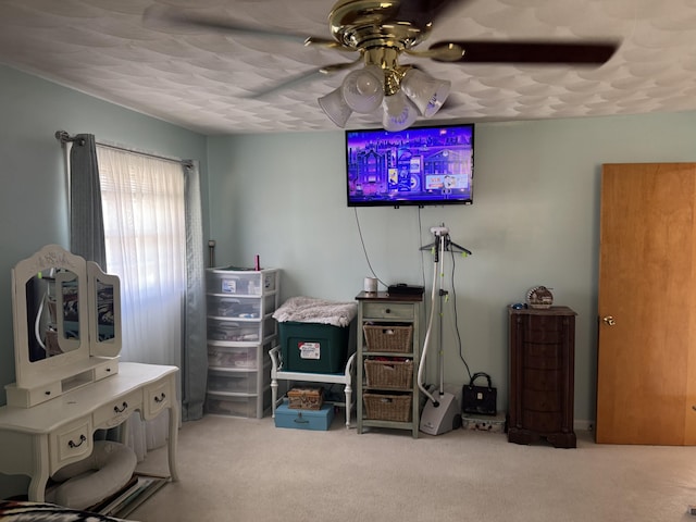 bedroom with carpet floors and a ceiling fan