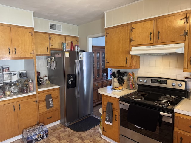 kitchen with light floors, visible vents, stainless steel appliances, light countertops, and under cabinet range hood