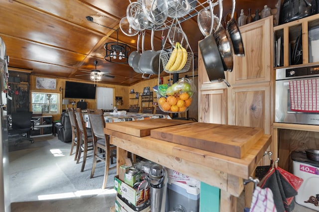 3860 Newfound Rd, Oneida, KY 40972 - carpeted dining space featuring a ceiling fan, wooden walls, and wood ceiling