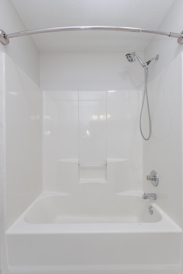 bathroom with shower / bath combination