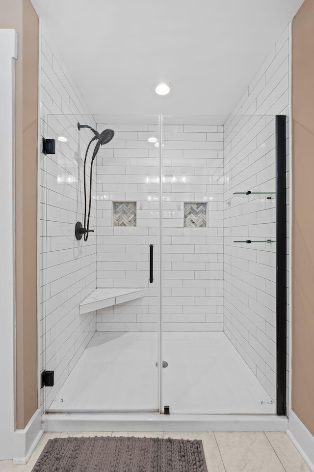 bathroom with a shower stall