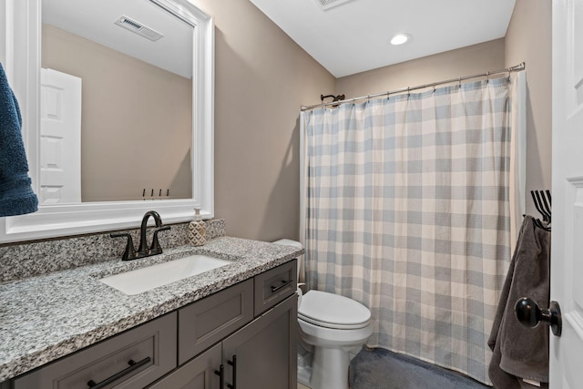 full bath with visible vents, toilet, vanity, and a shower with curtain