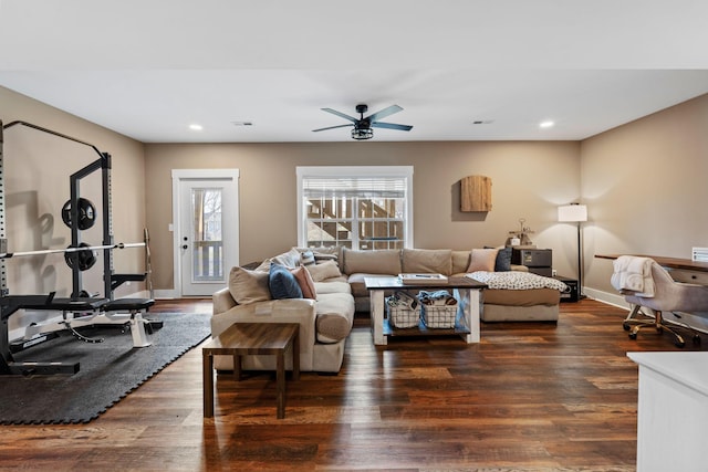 living area with dark wood finished floors, recessed lighting, a ceiling fan, and baseboards