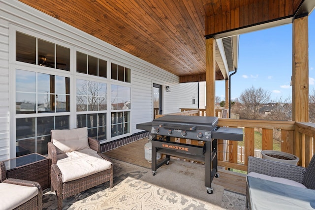 wooden deck featuring grilling area