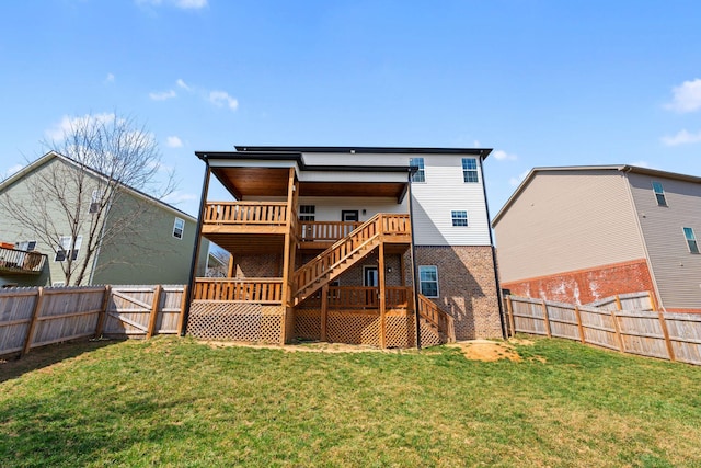 back of house with stairway, a wooden deck, a fenced backyard, a lawn, and brick siding