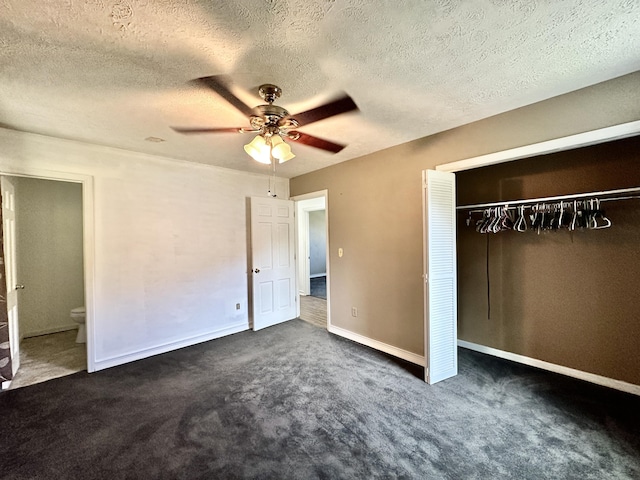 unfurnished bedroom featuring a ceiling fan, baseboards, a closet, a textured ceiling, and carpet flooring