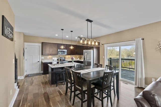 dining area with visible vents, recessed lighting, baseboards, and wood-type flooring