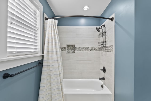 bathroom with shower / bathtub combination with curtain