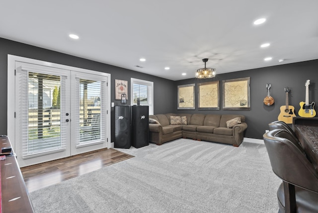 living area featuring visible vents, recessed lighting, french doors, and baseboards