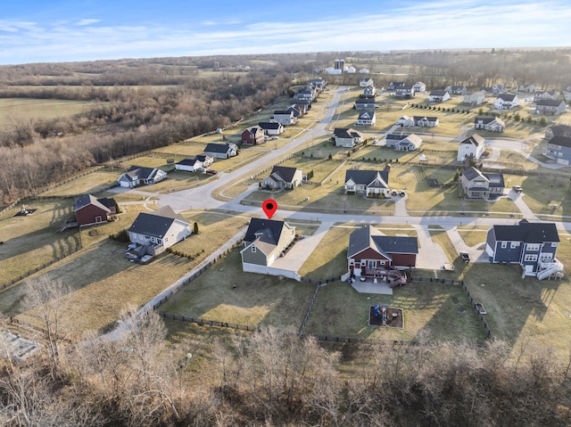 birds eye view of property with a residential view