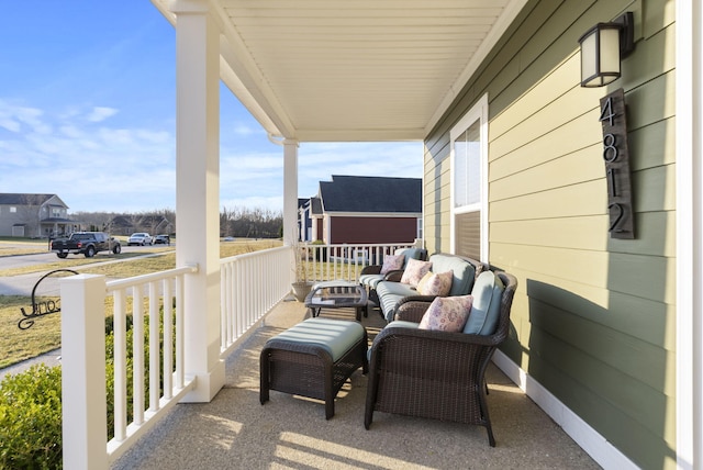 balcony featuring a porch