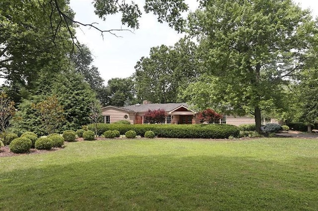 exterior space with a front yard